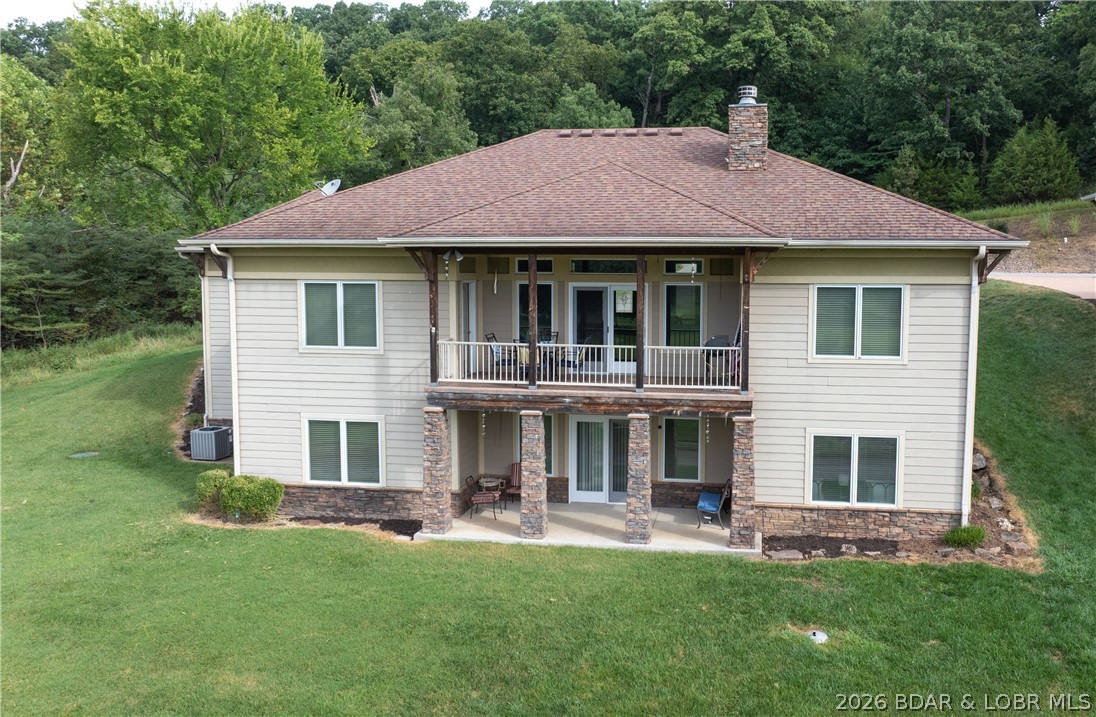 Primary bedroom — 403 Payne Stewart Court Lake Ozark Missouri real estate